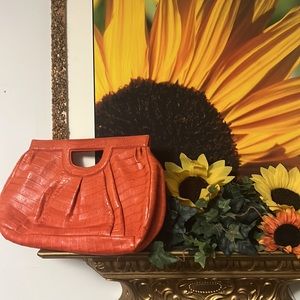 Nancy Gonzales beautiful burnt orange genuine leather clutch. They’re back!!!!